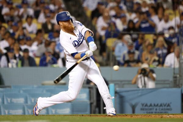 Justin Turner #10 of the Los Angeles Dodgers hits an RBI double during the sixth inning against the New York Mets at Dodger Stadium, in Los Angeles, on June 2, 2022. (Katelyn Mulcahy/Getty Images)