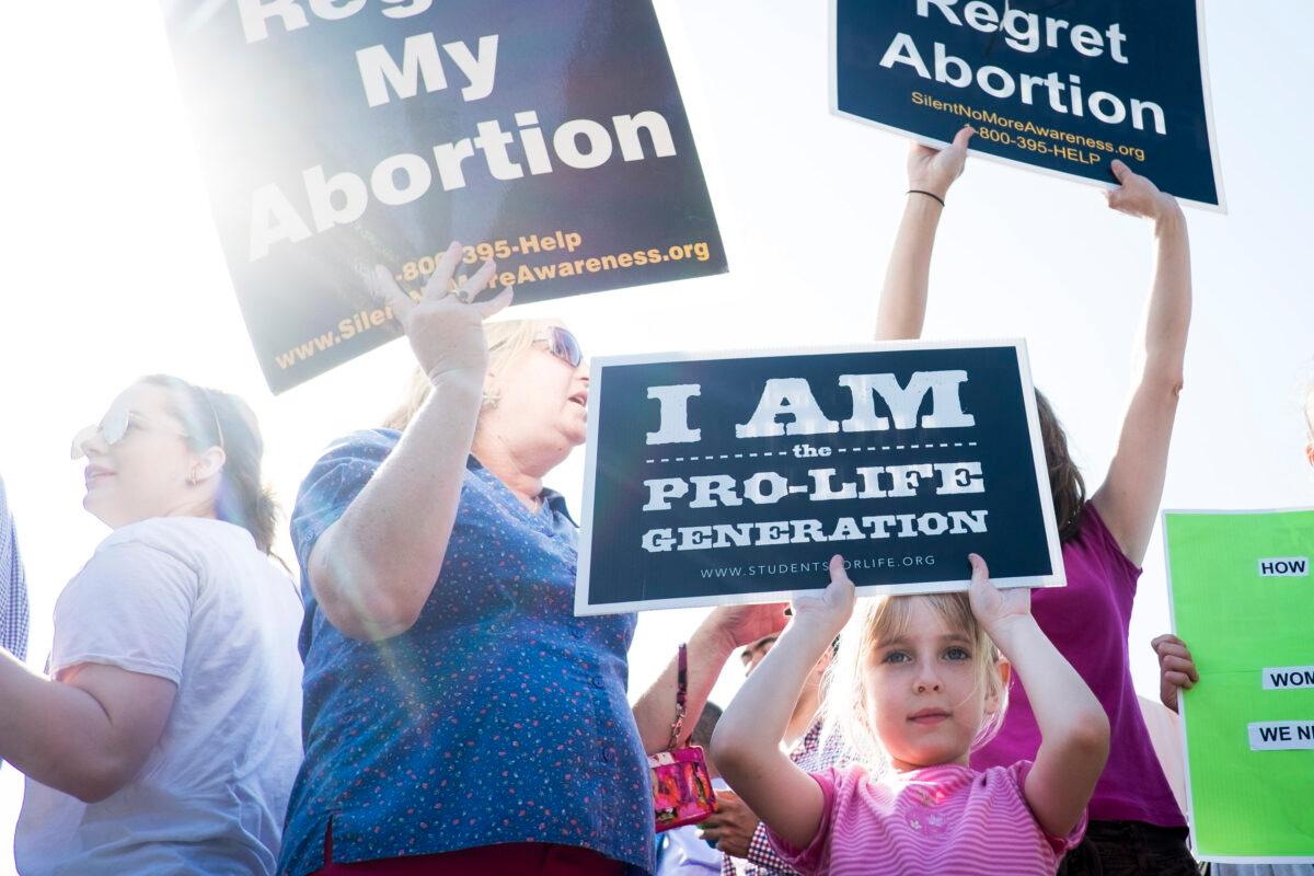 Pro-life activists demonstrate on the steps of the U.S. Supreme Court in Washington on June 27, 2016. (Pete Marovich/Getty Images)