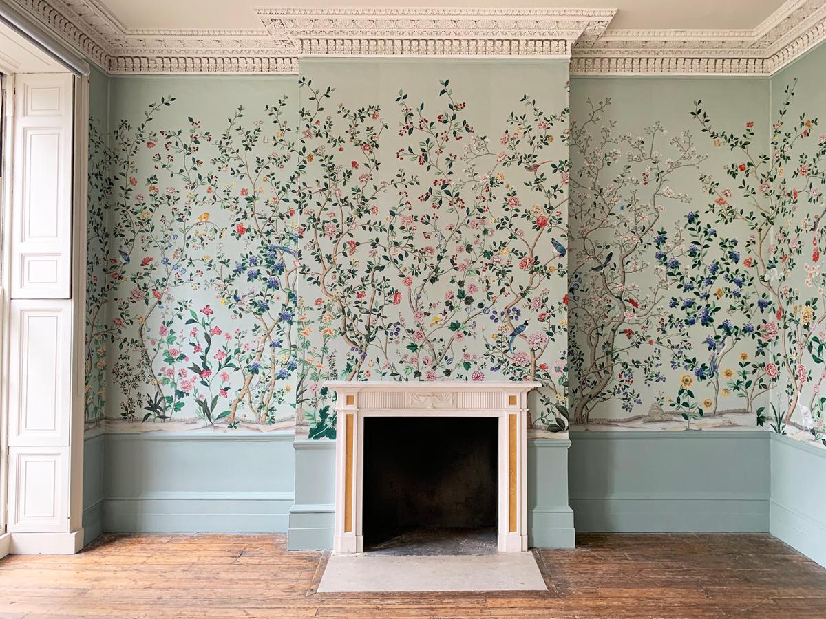 "Erdem" on Adam Grey dyed silk, a collaboration between de Gournay and fashion designer Erdem Moralioglu. The capsule collection depicts sparrows, warblers, pheasants, and egrets among hydrangeas, hollyhocks, irises, chrysanthemums, and morning glories. (Courtesy of de Gournay)