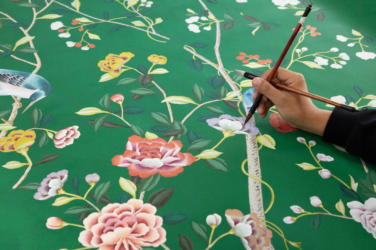 De Gournay artists paint each design by hand with a two-brush technique: one brush for pigment, the other for water. The technique takes hours to execute—and years to master. (Courtesy of de Gournay)
