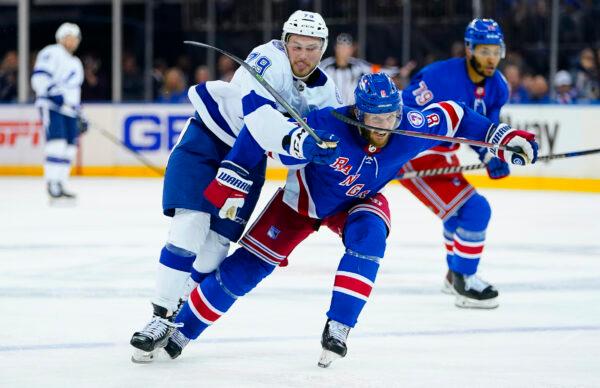 New York Rangers defenseman K'Andre Miller (79) and New York Rangers defenseman Jacob Trouba (8) chase down the puck during the third period in Game 5 of the NHL Hockey Stanley Cup playoffs Eastern Conference Finals in New York, on June 9, 2022. (Frank Franklin II/AP Photo)