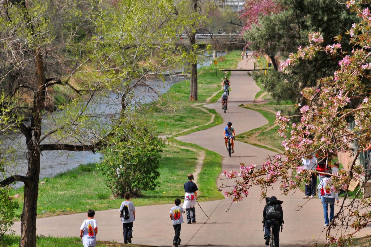 Riding a bike along the Cherry Creek Trail in Denver is a fun way to see much of the city. (Photo Courtesy of Visit Denver.)
