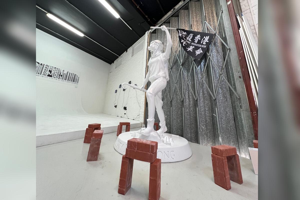 This 7-foot-tall “Hong Kong Statue of Democracy” with a brick array around its pedestal is the focal point of the exhibition. (Angela Chen/The Epoch Times UK)