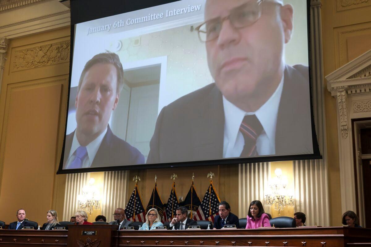 Video from an interview with former President Trump campaign manager William Stepien (L), and his attorney Kevin Marino, is played during a hearing by the Select Committee to Investigate the Jan. 6, 2021, U.S. Capitol breach, in Washington on June 13, 2022. (Alex Wong/Getty Images)