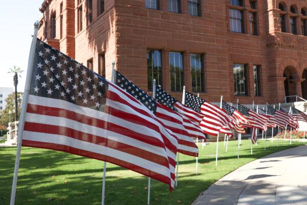 Hundreds of American flags are on display on the front lawn of the Old Orange County Courthouse in Santa Ana, Calif., on June 13, 2022. (Julianne Foster/The Epoch Times)