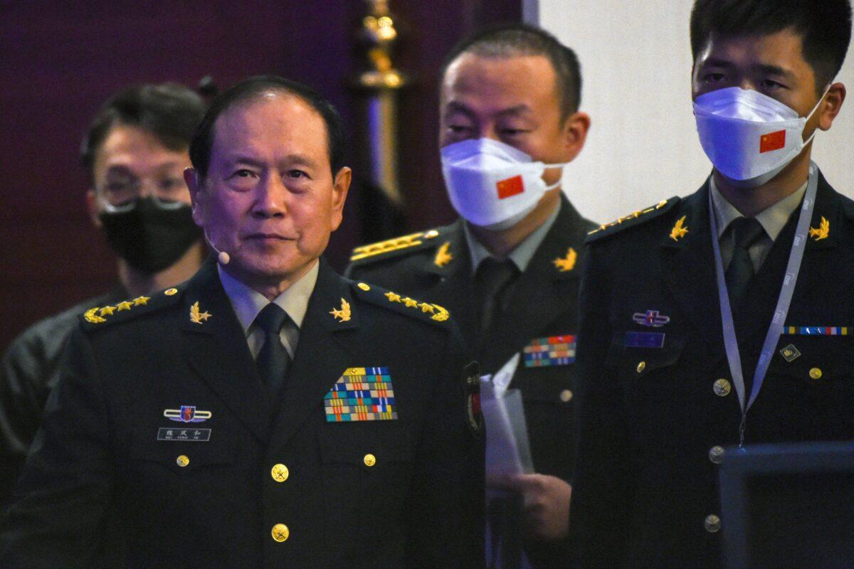 Chinese Defense Minister Wei Fenghe (front L) attends the Shangri-La Dialogue summit in Singapore on June 12, 2022. (Roslan Rahman/AFP via Getty Images)