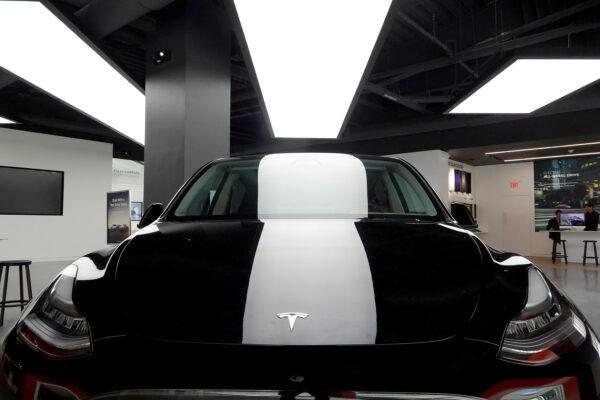 A Tesla Model Y electric vehicle is displayed on a showroom floor at the Miami Design District in Florida on Oct. 21, 2021. (Joe Raedle/Getty Images)