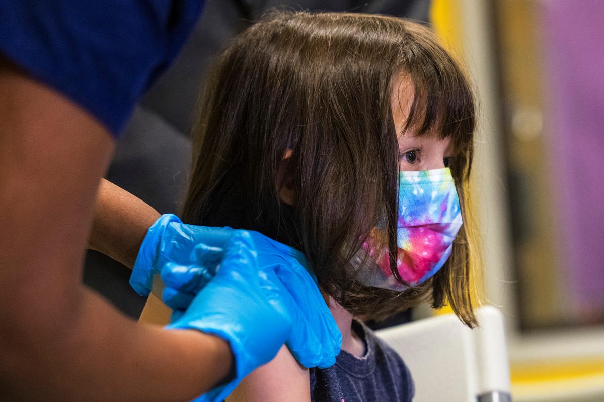 A 5-year-old girl gets a Pfizer COVID-19 vaccine on Nov. 8, 2021. (Michael M. Santiago/Getty Images)