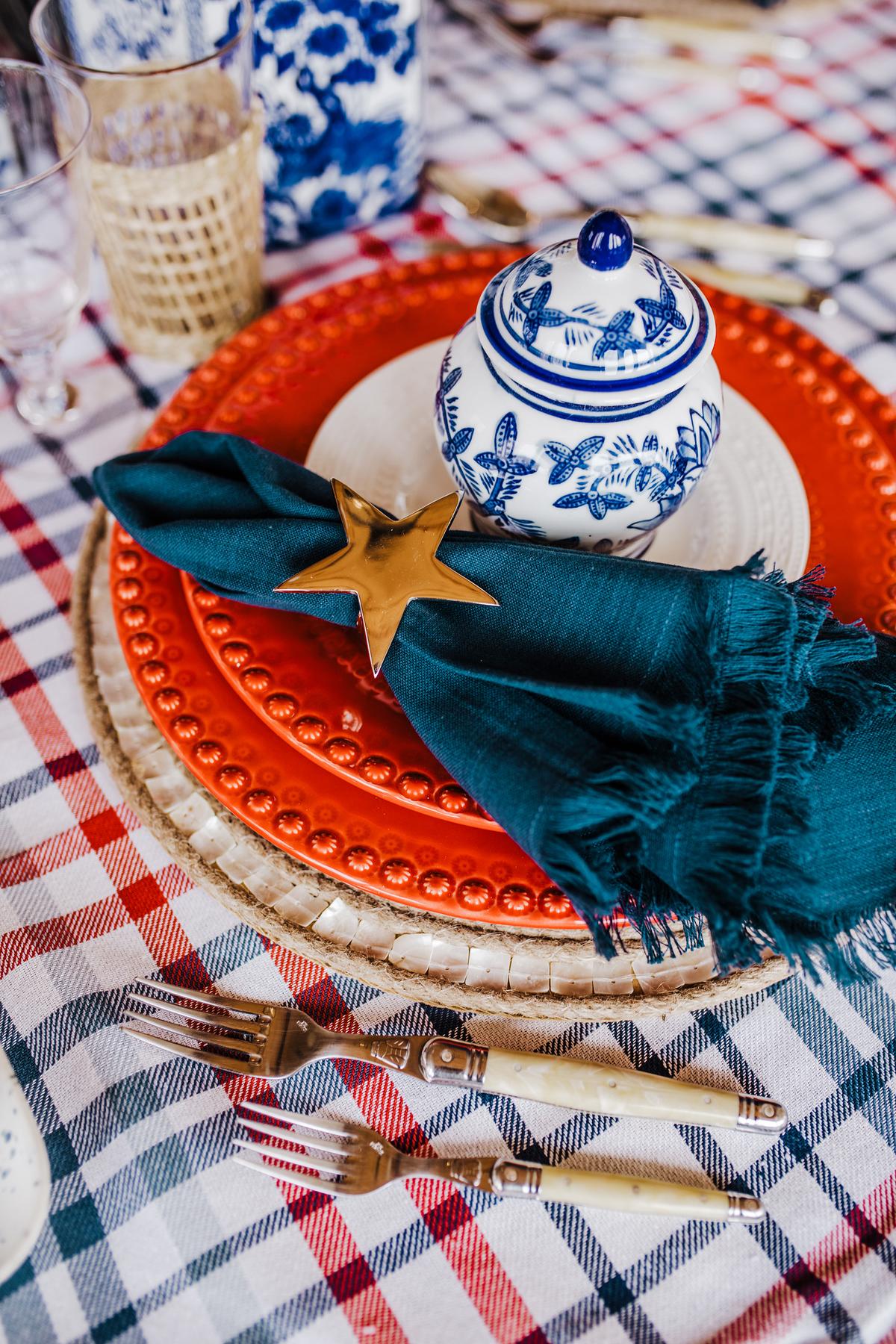 When bringing RWB onto your tabletop, it can be as easy as throwing a new linen on the table! (Nell Hill’s/TNS)