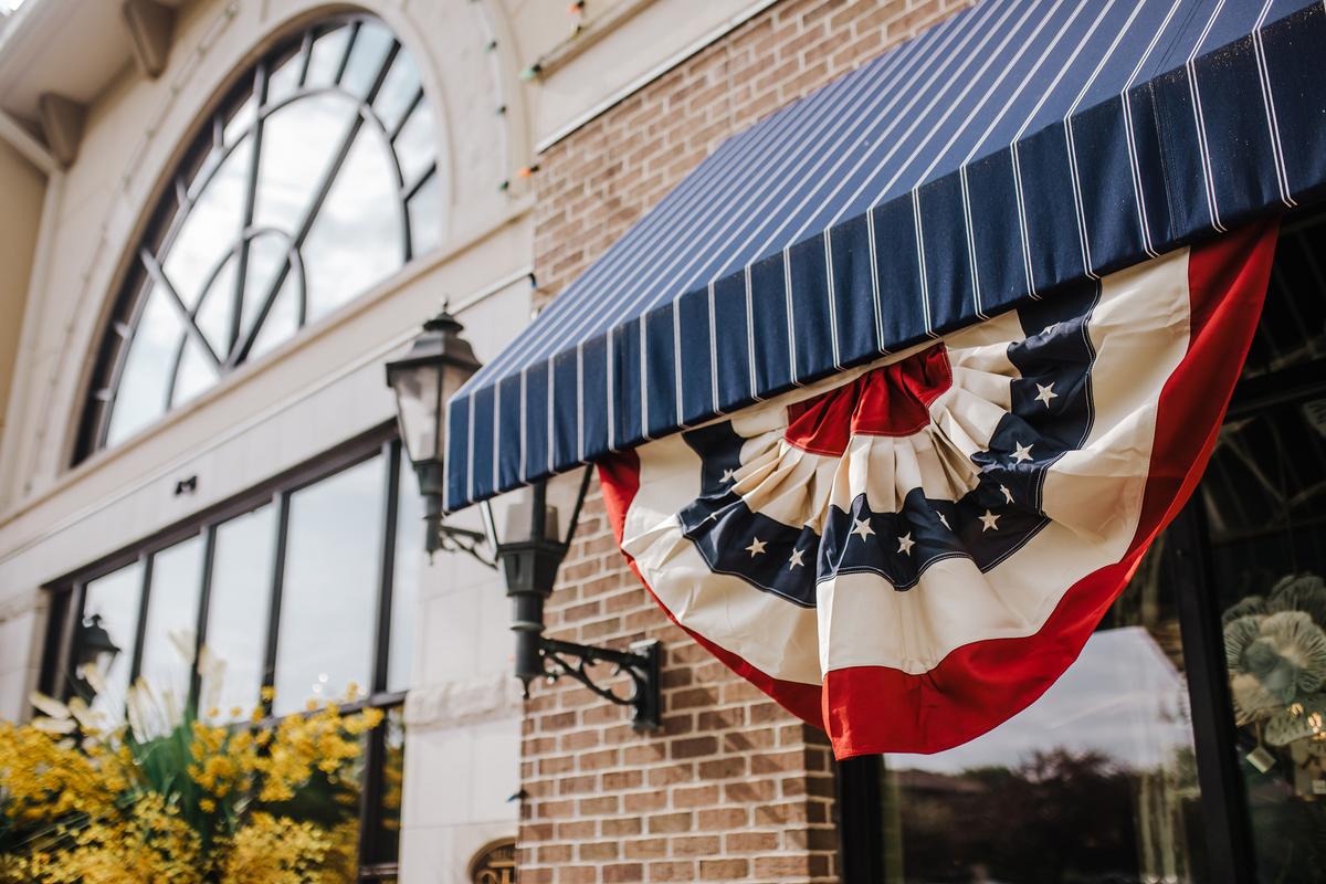 Flags and swags are a great way to add a pop of festiveness to the exterior of your home. (Nell Hill’s/TNS)