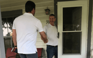 Republican candidate Derrick Anderson greets a voter while door-knocking in Orange County on June 19, 2022, during the last week before the Virginia Congressional District 7 Republican primary on June 21, which features six candidates, including four who entered the final weekend as self-professed frontrunners. (Courtesy of Derrick Anderson for Congress)