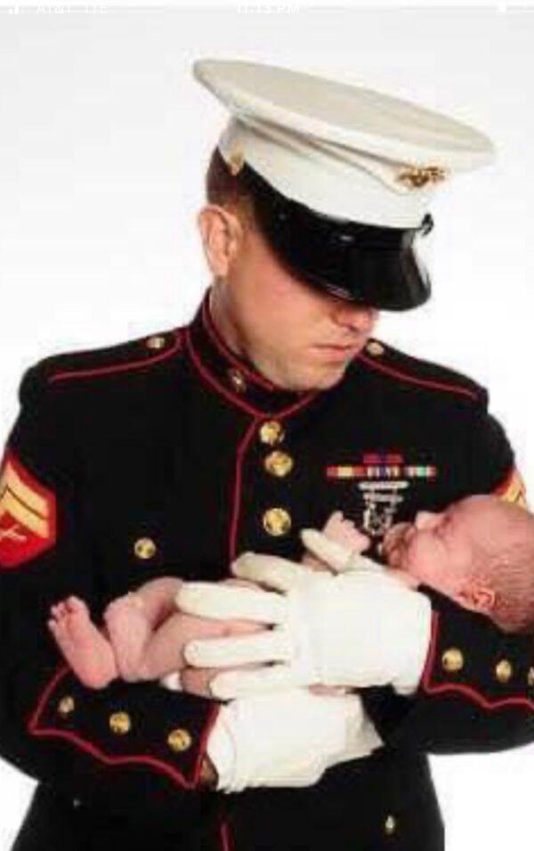 Marine veteran and Jan. 6 prisoner Ryan Nichols holds his son. (Courtesy of Bonnie Nichols)