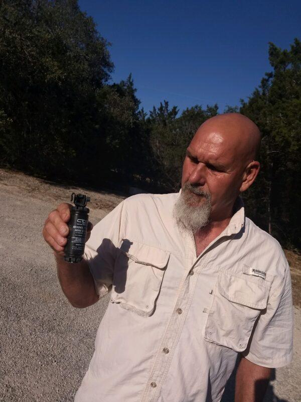 Darrel Kennemer holds a flash-bang he said the FBI threw at him during a raid on his home near San Marcus, Texas, on June 22, 2022. The FBI searched his home in connection with the Jan. 6, 2021, Capitol breach. (Courtesy of Lora DeWolfe)