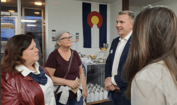 Tyler Allcorn, one of four Republicans on the June 28 Colorado Congressional District 8 Republican primary, speaks with voters at a March forum. (Courtesy of Allcorn For Colorado)