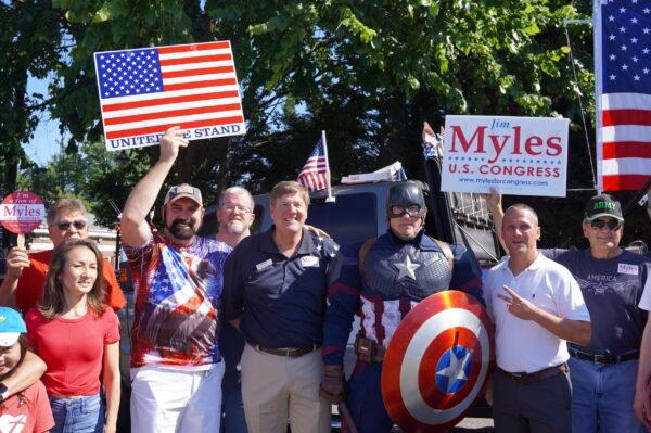 Republic Congressional candidate James Myles (C) with his supporters at the Independence Day parade in downtown Fairfax, Va., on July 4, 2022. (Terri Wu/The Epoch Times)