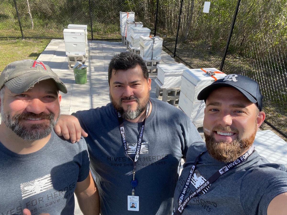 USMC veteran, founder, and CEO of Hives for Heroes, Steve Jimenez (L), with USMC veteran and director of service, Javier Delgado (C), and Brett Harmeling, of the board of advisors, at the apiary at TechnipFMC in Houston. (Courtesy of Hives for Heroes)