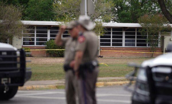 State troopers stand outside of Robb Elementary School in Uvalde, Texas, on May 24, 2022. (Alison Dinner/AFP via Getty Images)