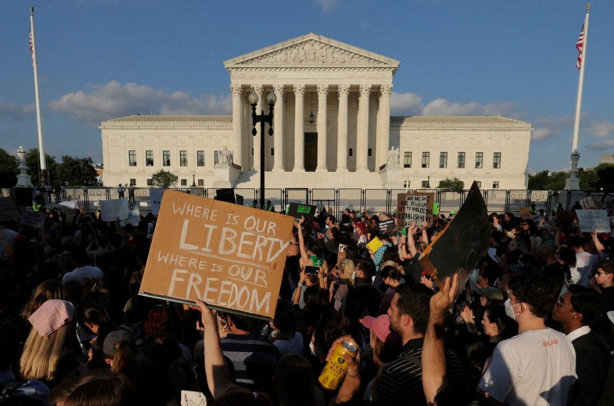 Pro-abortion protesters outside the U.S. Supreme Court as the court rules in the Dobbs v. Women's Health Organization abortion case, overturning the landmark Roe v. Wade abortion decision in Washington, on June 24, 2022. (Jim Bourg/File Photo/Reuters)