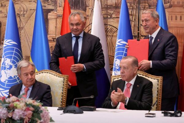 U.N. Secretary-General Antonio Guterres, Russia's Defence Minister Sergei Shoigu and Turkish President Recep Tayyip Erdogan, and Turkish Defence Minister Hulusi Akar attend a signing ceremony in Istanbul, Turkey, on July 22, 2022. (Umit Bektas/Reuters)
