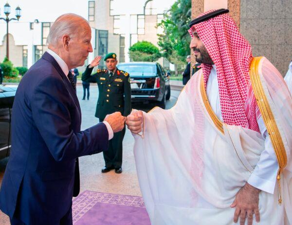 Saudi Crown Prince Mohammed bin Salman (R) greets President Joe Biden with a fist bump after his arrival in Jeddah, Saudi Arabia, on July 15, 2022. (Bandar Aljaloud/Saudi Royal Palace via AP)