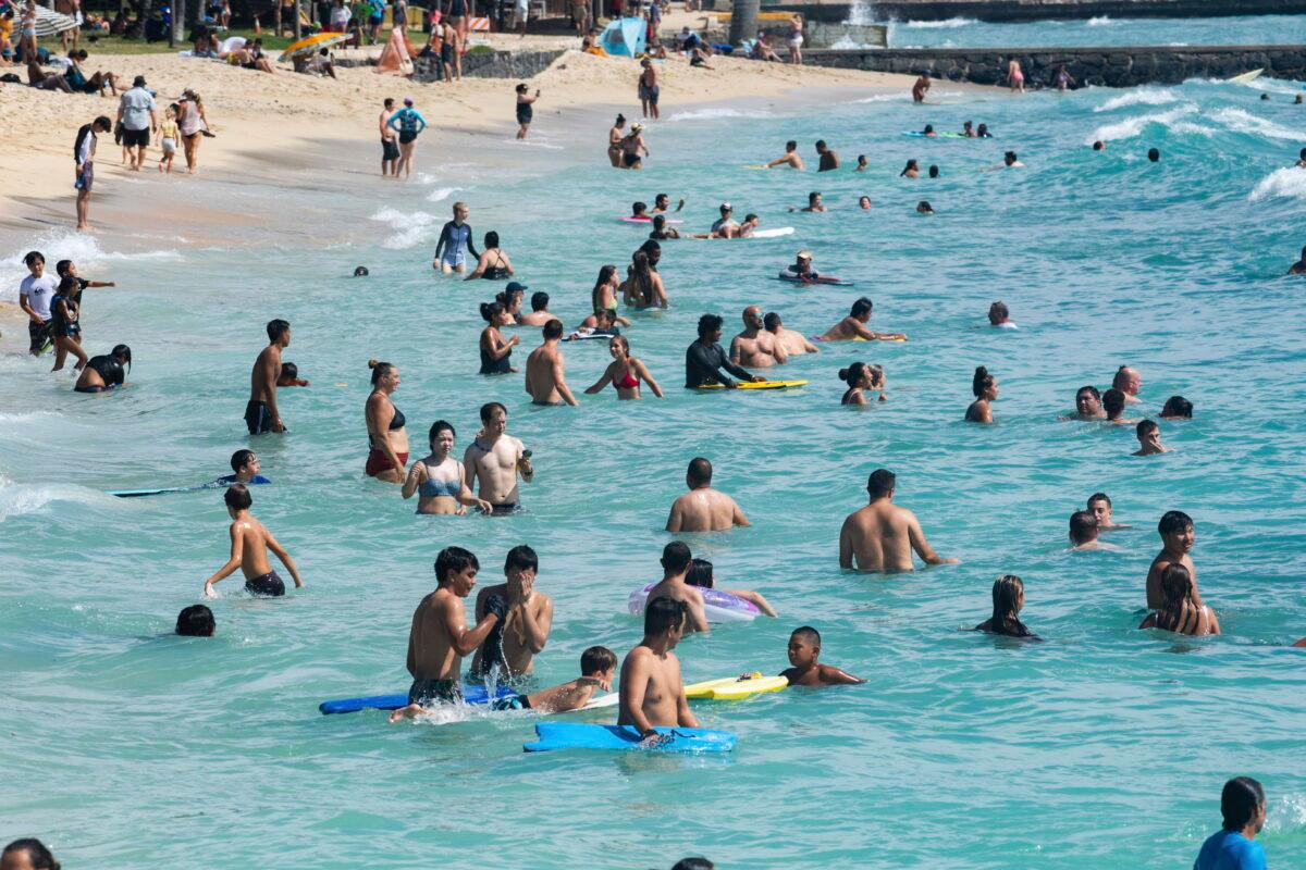 Swimmers, boogie boarders, and surfers made good use of high swells in Waikiki, Hawaii, on July 17, 2022. (Craig T. Kojima/Honolulu Star-Advertiser via AP)
