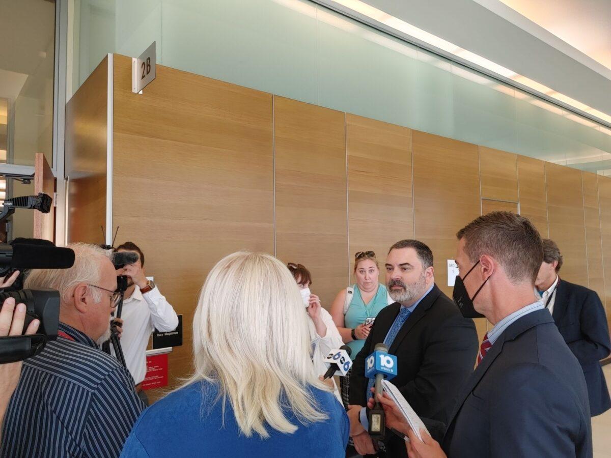 Bryan Bowen (3rd R), an attorney representing Gerson Fuentes, talks to reporters after a video arraignment hearing in Columbus, Ohio, on July 25, 2022. (Jeff Louderback/Epoch Times)