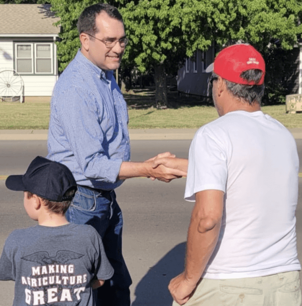 Kansas attorney general Derek Schmidt, who is running for governor in November’s election, greets voters at the Sedgwick County Fair in Cheney, Kansas, on July 20. (Courtesy of Schmidt for Kansas)