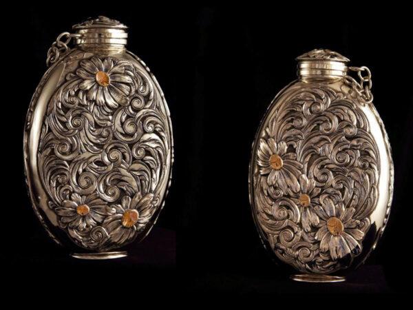 Palm flask (8 oz. ), 2019, by Scott Hardy. Sterling silver with sterling silver scroll and flower overlays, and 14-karat gold flower centers. (Leslie Hardy)
