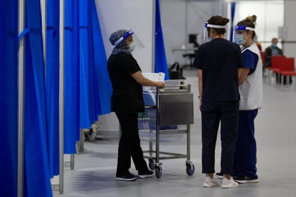 Staff are seen inside the Melbourne Exhibition Centre COVID-19 Vaccination Centre in Melbourne, Australia, on May 28, 2021. (Darrian Traynor/Getty Images)