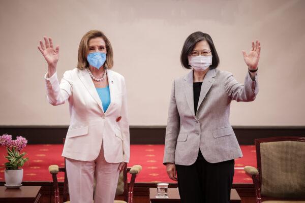 (L-R) U.S. House Speaker Nancy Pelosi (D-Calif.) poses for photographs with Taiwan's President Tsai Ing-wen, at the president's office in Taipei, Taiwan, on Aug. 3, 2022. (Handout/Getty Images)