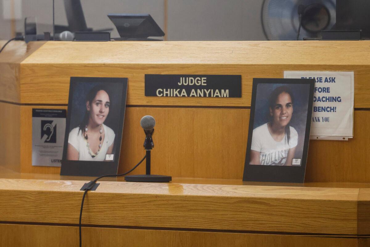Photos of Sarah and Amina Said are shown during the second day of trial for Yaser Said at the Frank Crowley Courts Building in Dallas on Aug. 3, 2022. (Shafkat Anowar/The Dallas Morning News via AP)