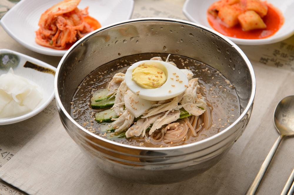 Sliced brisket, hard-boiled eggs, cucumber, and Asian pear are common toppings, but there’s no limit to the number of variations naengmyeon can accommodate. (photohwan/Shutterstock)