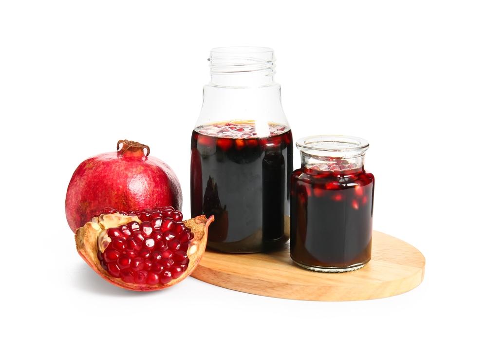 A condiment made from the reduction of pomegranate juice, pomegranate molasses is a staple of North African and Levantine cuisines. (Pixel-Shot/Shutterstock)