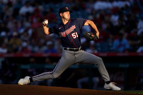 Minnesota Twins starting pitcher Tyler Mahle (51) throws during the first inning of a baseball game against the Los Angeles Angels in Anaheim, Calif., Aug. 12, 2022. (Ashley Landis/AP Photo)