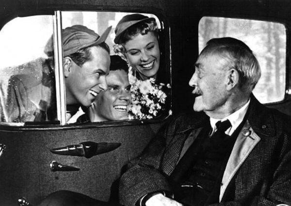 A group of hitchhikers hitch a ride with Isak Borg (Victor Sjostrom) in his spacious car and engage in lively conversation in a scene from Ingmar Bergman's film "Wild Strawberries." (Criterion Collection)