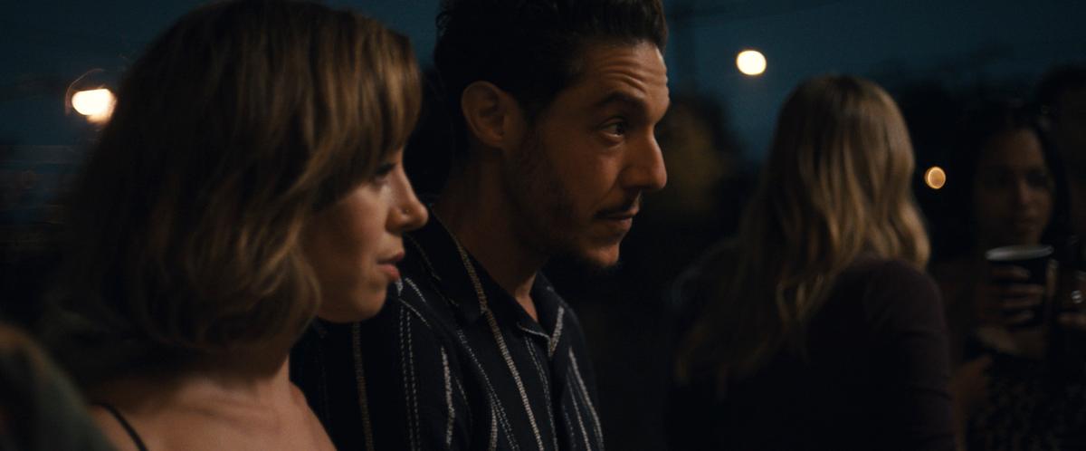 Emily (Aubrey Plaza) and Youcef (Theo Rossi) attend a party, in "Emily the Criminal." (Roadside Attractions/Universal Pictures)