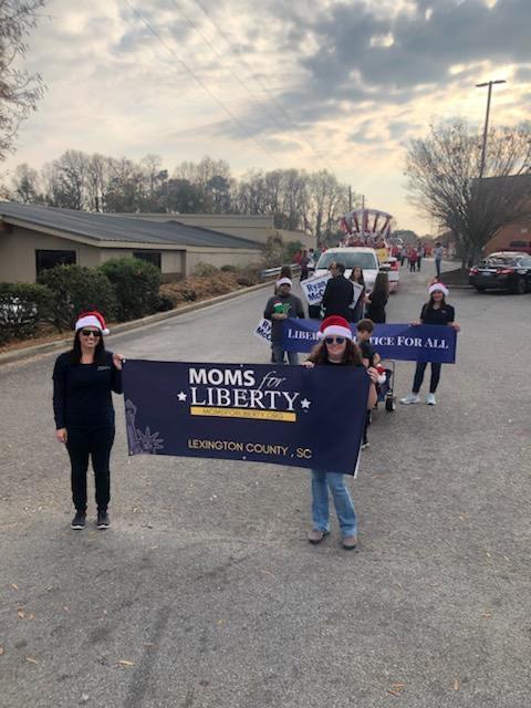 Christa Sorrenti, Kourtney Elizabeth, and others participate in a Christmas parade in Lexington County, South Carolina. (Courtesy of Moms for Liberty)