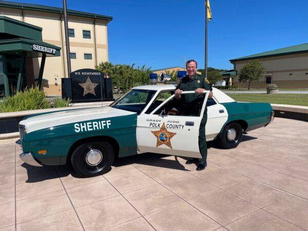 Polk County Sheriff Grady Judd poses in front of a replica of his 1972 Ford Galaxie; the same model and year of his first police cruiser when he began his career in law enforcement. Aug. 19, 2022. (Courtesy of Polk County Sheriff's Office)