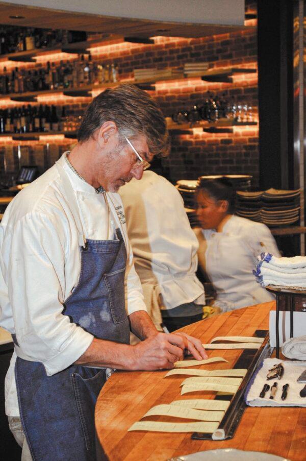 Chef Hastings takes orders on a busy day at the restaurant. (Karim Shamsi-Basha for American Essence)