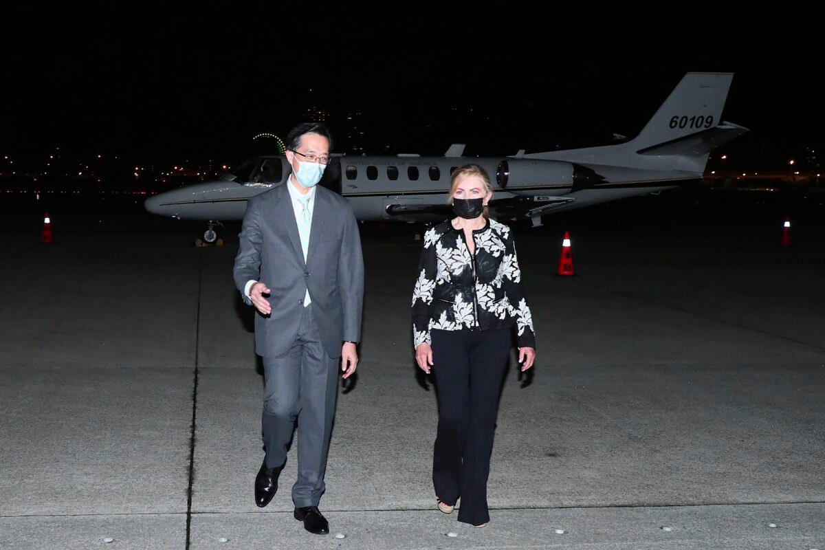 U.S. Sen. Marsha Blackburn (R-Tenn.) walks with Douglas Yu-Tien Hsu (L), Director-General, Taiwan's dept. of North American Affairs, as she arrives on a plane in Taipei, Taiwan, on Aug. 25, 2022. (Taiwan Ministry of Foreign Affairs via AP)