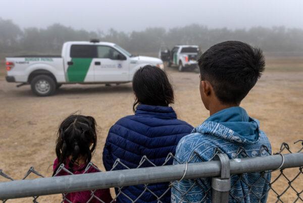 Unaccompanied minors wait to be processed by Border Patrol agents near the U.S.–Mexico border in La Joya, Texas, on April 10, 2021. (John Moore/Getty Images)