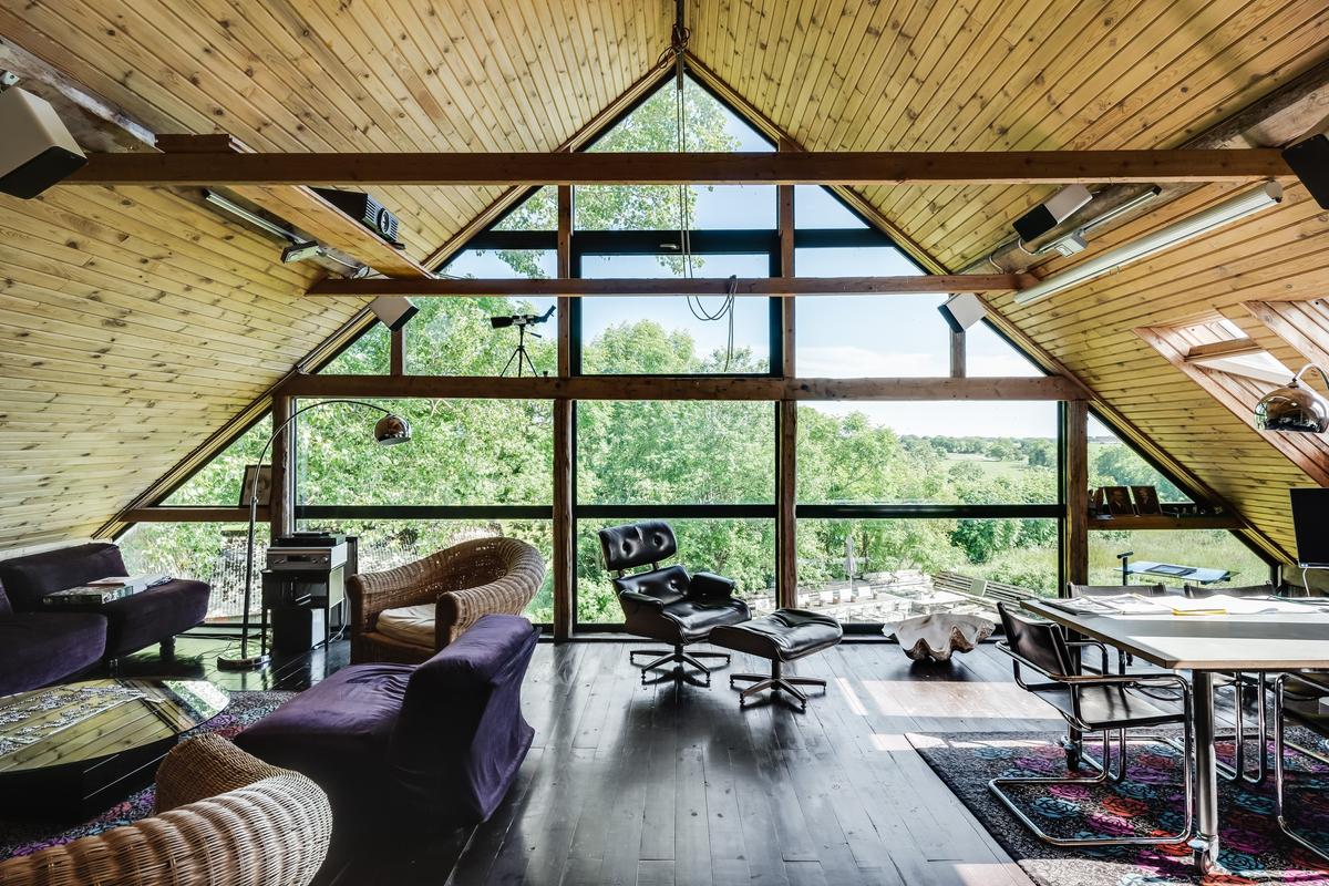A well-appointed office on the upper level overlooks the restful Swedish countryside and the sea beyond. (Courtesy of Sweden Sotheby’s International Realty)