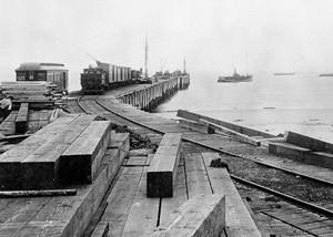 McFadden Wharf, next to railroad tracks at Newport Bay in 1892. (Public Domain)