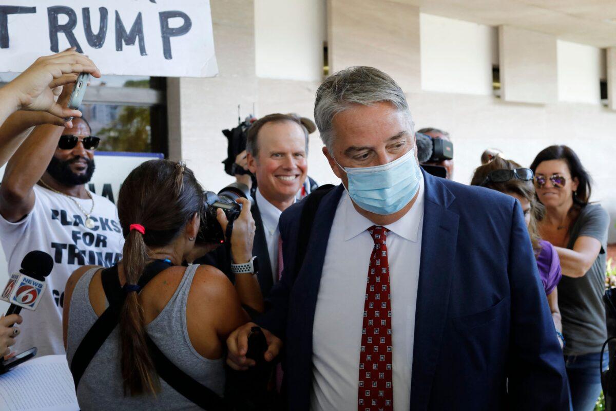 Jim Trusty (C), followed by fellow lawyer for former President Donald Trump Chris Kise, leaves the federal courthouse in West Palm Beach, Fla., on Sept. 1, 2022. (Marco Bello/AFP via Getty Images)