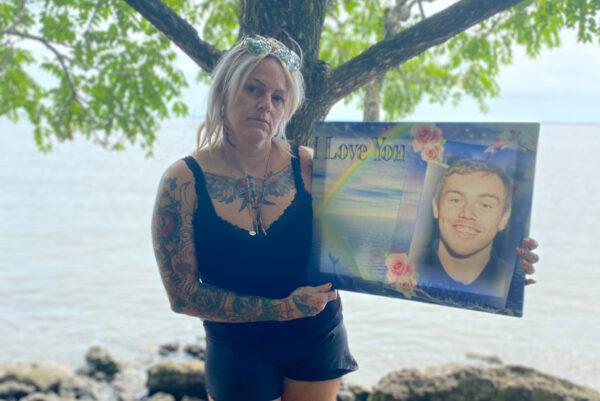 April Babcock holds a picture of her son Austen, who died in January 2019 after unknowingly taking some fentanyl-laced cocaine. (Courtesy of April Babcock)