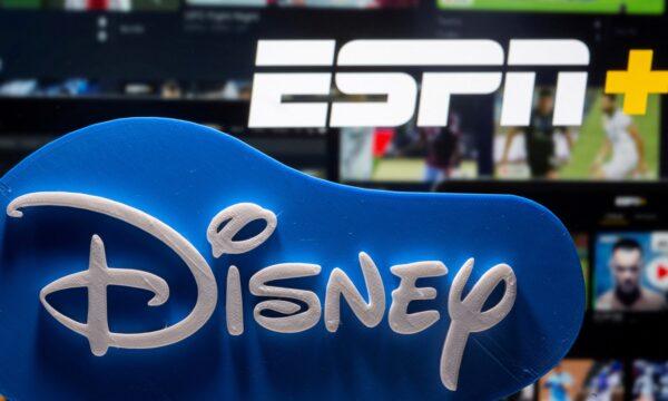 A 3D-printed Disney logo in front of the ESPN+ logo in a photo illustration taken on July 13, 2021. (Dado Ruvic/Illustration/Reuters)