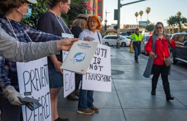 Demonstrators in downtown Los Angeles speak out about complications associated with "gender-reassignment" surgeries on March 12, 2022. (John Fredricks/The Epoch Times)