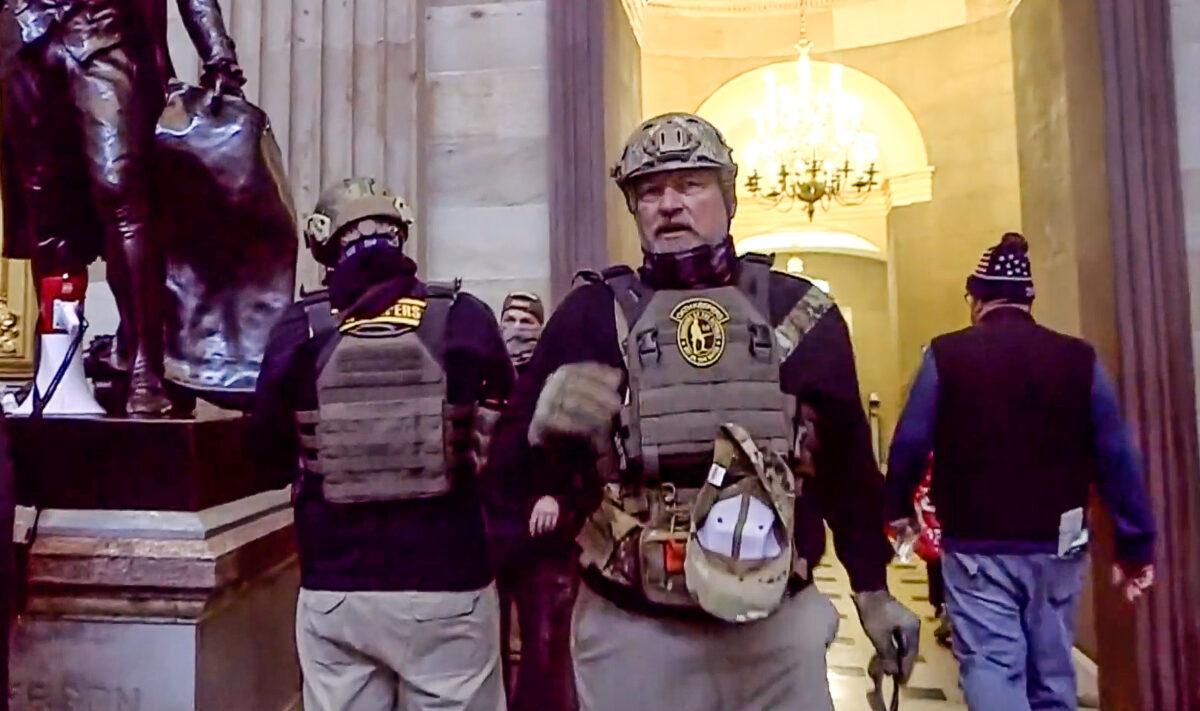 Two Oath Keepers inside the U.S. Capitol on Jan. 6, 2021. Founder Stewart Rhodes said he initially had no idea that Oath Keepers had entered the Capitol. (U.S. DOJ/Screenshot via The Epoch Times)