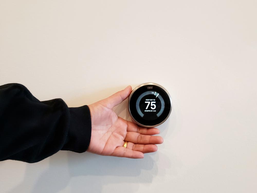 If your budget allows, consider investing in a Wi-Fi thermostat. (ifoodijourney/Shutterstock)