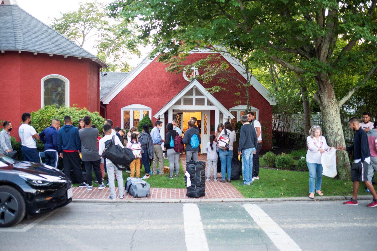 Illegal immigrants from Venezuela stand outside St. Andrew's Church in Edgartown, Martha's Vineyard, Mass., on Sept. 14, 2022. (Ray Ewing/Vineyard Gazette/Handout via Reuters)